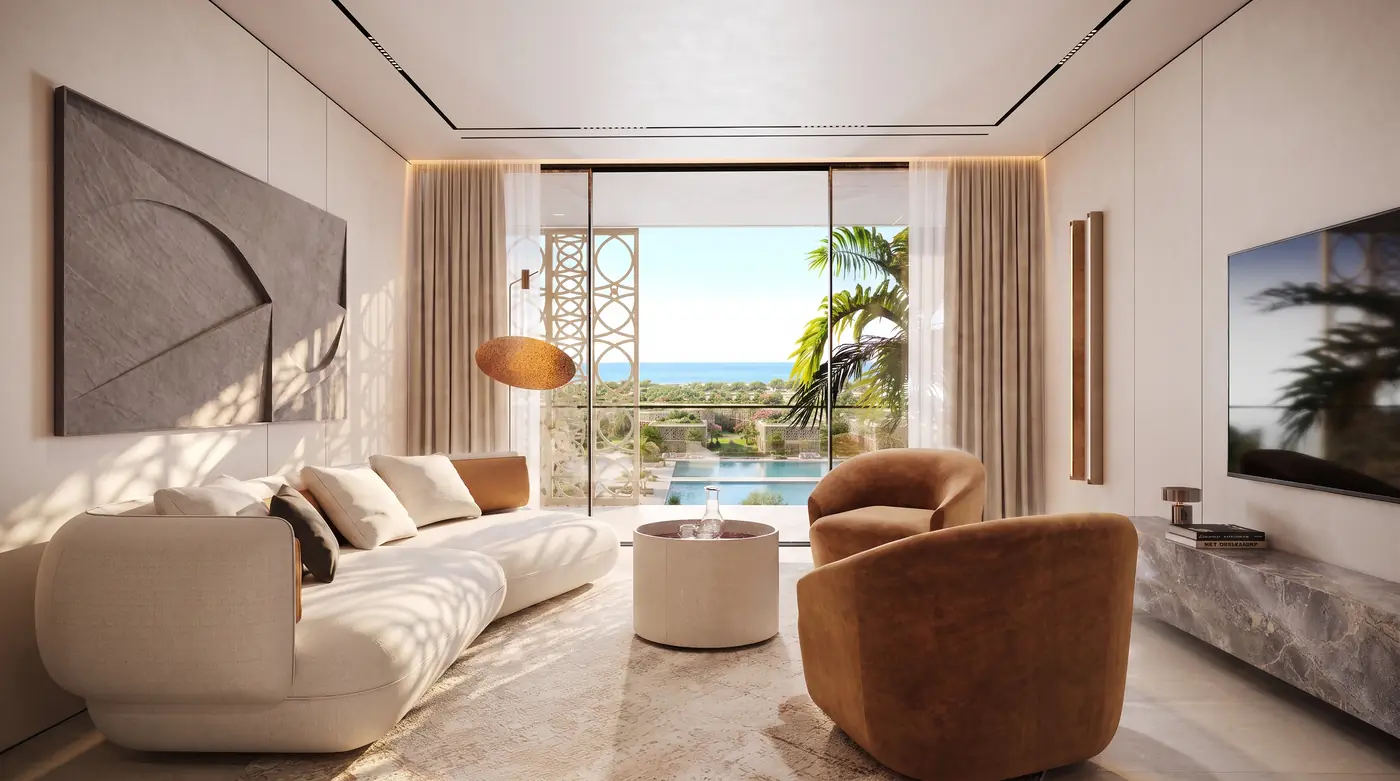 Furnished living room of a Mira Ocean Estates apartment with sofa, curved armchairs and sea view terrace